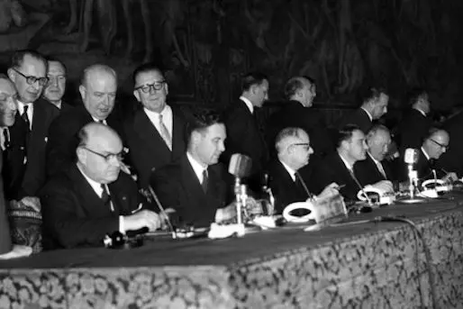 European polititicians are concentrated while signing the treaty for the European Common Market and Euratom, in Rome\\'s City Hall, Italy, March 25, 1957. From left to right: Paul Henri Spaak, Belgian Foreign Minister, his Undersecretary Baron Snoy, French Foreign Minister Christian Pineau and his Undersecretary Maurice Faure, German Chancellor Konrad Adenauer, German Undersecretary of Foreign Affairs Walter Hallstein. An unidentified official bows over the table after Hallstein. (AP Photo/Mario Torrisi)