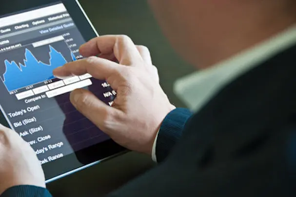 Closeup of a businessman accessing his digital tablet PC