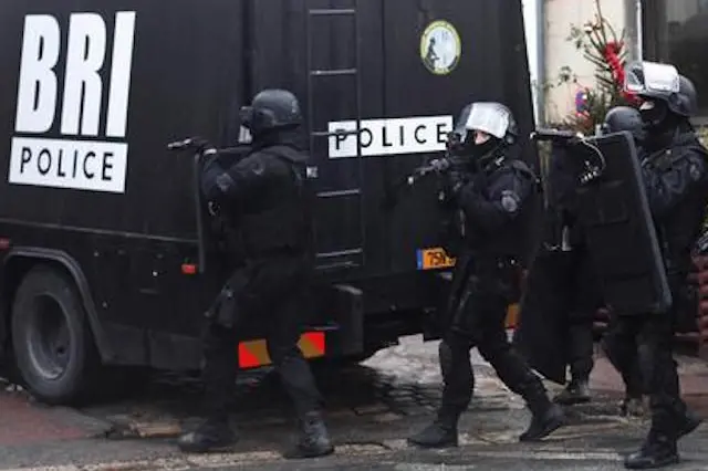 French riot officers patrol in Longpont, north of Paris, France, Thursday, Jan. 8, 2015. Scattered gunfire and explosions shook France on Thursday as its frightened yet defiant citizens held a day of mourning for 12 people slain at a Paris newspaper. French police hunted down the two heavily armed brothers suspected in the massacre to make sure they don\\'t strike again. (AP Photo/Thibault Camus) [Credit: ANSA]