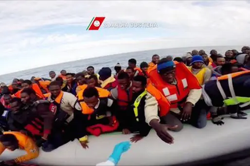 This video grab released by the Italian Coast Guards (Guardia Costiera) on February 18, 2015 shows migrants during a rescue operation, yesterday, off the coast of Sicily as part of the Triton plan (Frontex). A total of 5,302 migrants have arrived in Italy from Libya since the start of January, a 59 percent increase on the same period in 2014.  More than 300 Africans have died at sea in the last week alone in what aid workers suspect is a sign of people smugglers trying to get their human convoys out of Libya as soon as possible. AFP PHOTO / HO\\r\\n= RESTRICTED TO EDITORIAL USE - MANDATORY CREDIT \"AFP PHOTO / GUARDIA COSTIERA\" - NO MARKETING NO ADVERTISING CAMPAIGNS - DISTRIBUTED AS A SERVICE TO CLIENTS =\\r\\n