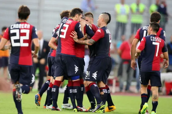 CAGLIARI, ITALY - OCTOBER 19: Victor Ibarbo (hidden) of Cagliari celebrates the goal with the teammates after scoring the goal 1-1 during the Serie A match between Cagliari Calcio and Calcio Catania at Stadio Sant\\'Elia on October 19, 2013 in Cagliari, Italy.  (Photo by Enrico Locci/Getty Images)