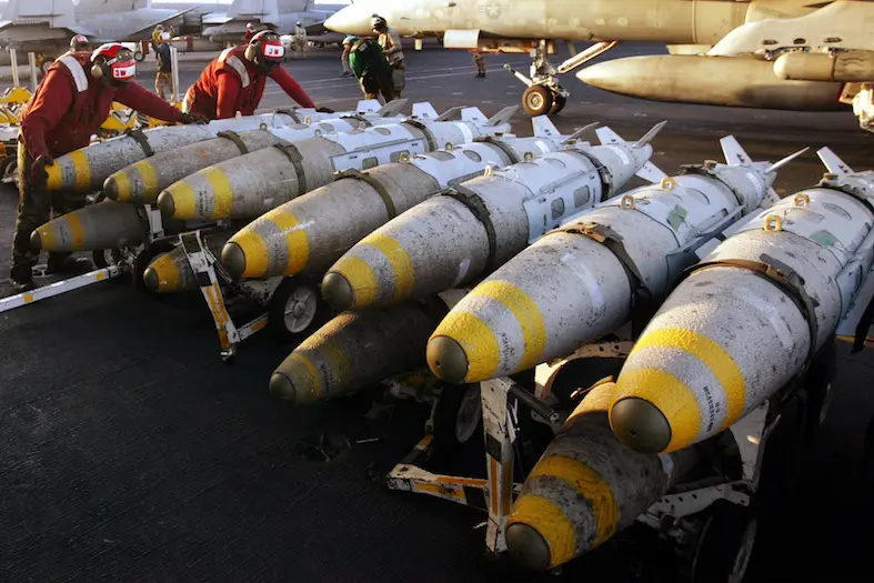 Aviation ordinancemen organise 1000 pound MK-83 JDAM (Joint Direct\\r\\nAttack Munitions) bombs on their racks on the flight deck of the USS\\r\\nKitty Hawk aircraft carrier in the northern Gulf March 18, 2003. Saddam\\r\\nHussein rejected an ultimatum to quit Iraq and vowed on Tuesday to\\r\\nfight a U.S.-led invasion that could start in just over a day - and\\r\\nwhich Britain said could define world affairs for decades. REUTERS/Paul\\r\\nHanna\\r\\n\\r\\nPH/CRB - RTRKAF3