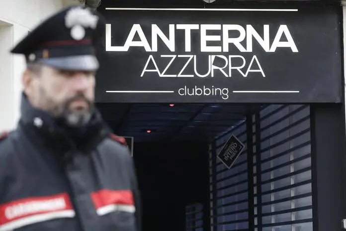 A Carabiniere officer stands in front of the disco \\'Lanterna Azzurra\\' in Corinaldo, central Italy, Saturday, Dec. 8, 2018. At least Six people, all but one of them minors, were killed and about 35 others injured in a stampede of panicked concertgoers early Saturday at a disco in a small town on Italy\\'s central Adriatic coast. (ANSA/AP Photo/Andrew Medichini) [CopyrightNotice: Copyright 2018 The Associated Press. All rights reserved.]