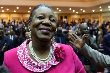 The mayor of Bangui, Catherine Samba-Panza, smiles after being elected interim president of the Central African Republic on January 20, 2014, in Bangui. Samba-Panza was elected in a second-round vote by the transitional parliament, securing 75 votes against 53 for Desire Kolingba, the son of a former Central African president.  AFP  PHOTO / ERIC FEFERBERG        (Photo credit should read ERIC FEFERBERG/AFP/Getty Images)