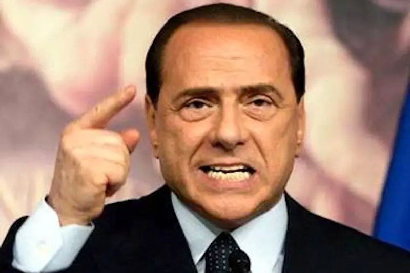 Italian Premier Silvio Berlusconi gestures as he delivers his speech during a press conference in Rome\\'s Chigi palace Premier\\'s office, Thursday, April 6, 2006. Berlusconi warned Italians on Thursday that \"freedom is at risk\" if the center-left coalition wins national elections in three days.(AP Photo/Gregorio Borgia)