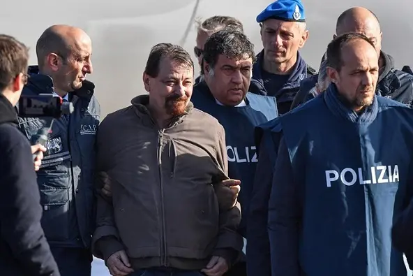 Former member of the group Armed Proletarians for Communism\\u00A0 Cesare Battisti, after arriving at Ciampino Airport in Rome, Italy,14 January 2019. Cesare Battisti, sought by Italian justice for four murders in the 1970s, has been arrested by international police squad in Santa Cruz, Bolivia.\\u00A0 \\nANSA/ALESSANDRO DI MEO\\n