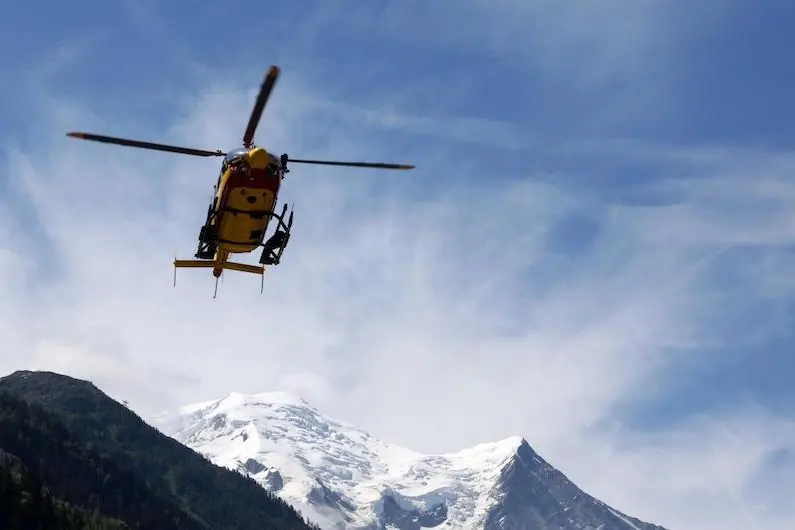 LaPresse12-07-2012 ChamonixCronacaFrancia, valanga sul Monte BiancoA rescue worker helicopter returning from the avalanche site,  lands in Chamonix, French Alps, Thursday, July, 12, 2012. An avalanche in the French Alps swept six European climbers to their deaths on a slope leading to Mont Blanc, and left at least nine others injured and several climbers unaccounted for, authorities said. Two climbers were rescued and emergency crews are searching for the missing. A group of 28 climbers from Switzerland, Germany, Spain, France, Denmark and Serbia are believed to be in the expedition caught in the avalanche that was about 4,000 meters (13,1000 feet) high on the north face of Mont Maudit, part of the Mont Blanc range.