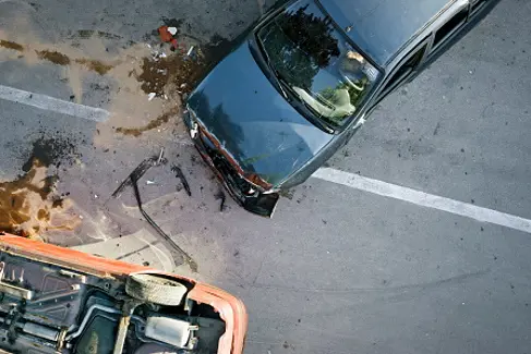 Elevated view of broken cars after accident.