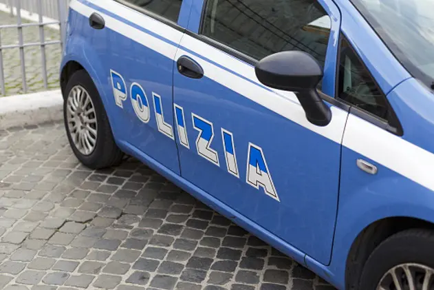 Blue police car with inscription police in Italian