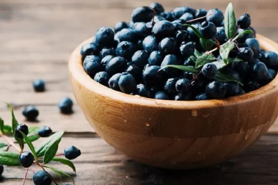 Myrtle berry on the wooden table, selective focus