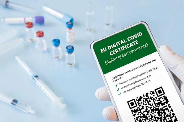 A smartphone with qr code in the app to confirm vaccination or a negative test for covid-19/ all the graphics are made up by author