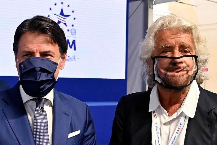 Beppe Grillo (R) with prime minister Giuseppe Conte (L) during the presentation of the 2019 Blue Book at the Customs and Monopolies Agency, Rome, Italy, 11 September 2020. ANSA/RICCARDO ANTIMIANI