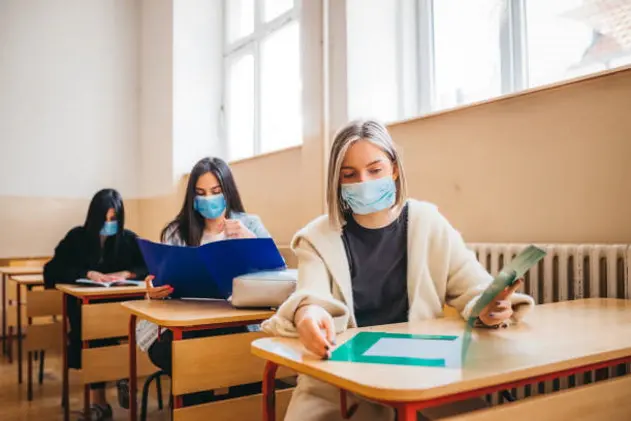 High school students in the benches after the pandemic corona virus