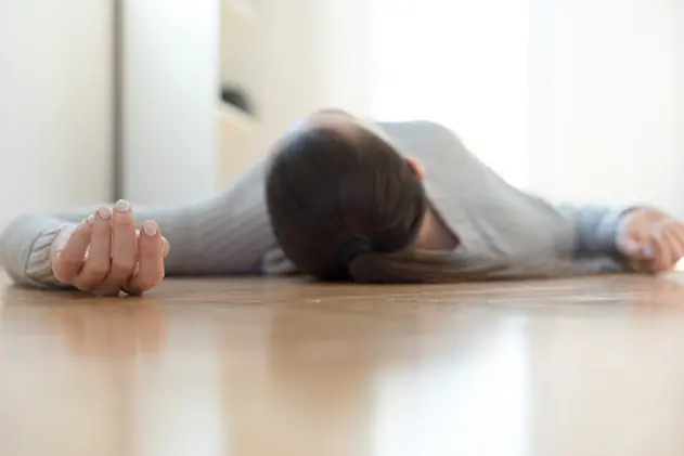 Woman lying on the floor at home