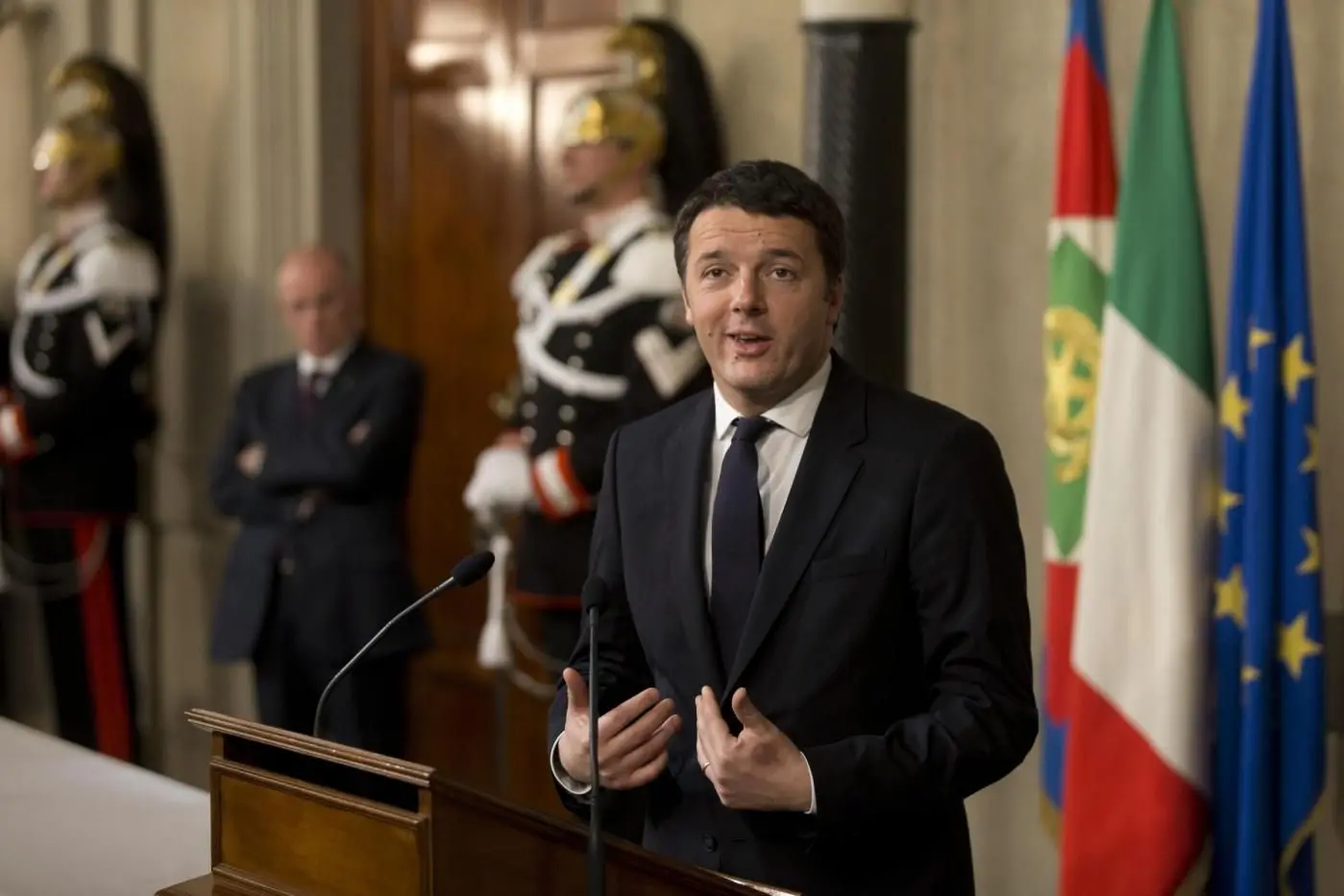 Italian Democratic Party\\'s leader Matteo Renzi talks to journalists at the Quirinale presidential palace after talks with Italan President Giorgio Napolitano, in Rome, Monday, Feb. 17, 2014. Renzi was asked to form a new government to replace the one he sacked through a stunning power-grab within his own party. Renzi drove himself to his meeting with Napolitano, mimicking the down-to-earth approach of his predecessor, Enrico Letta.(AP Photo/Alessandra Tarantino)