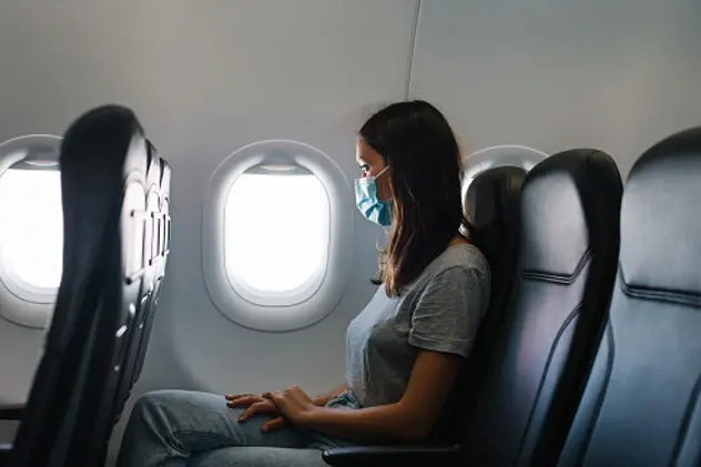 She looks out the window, as she waits for plane to take off