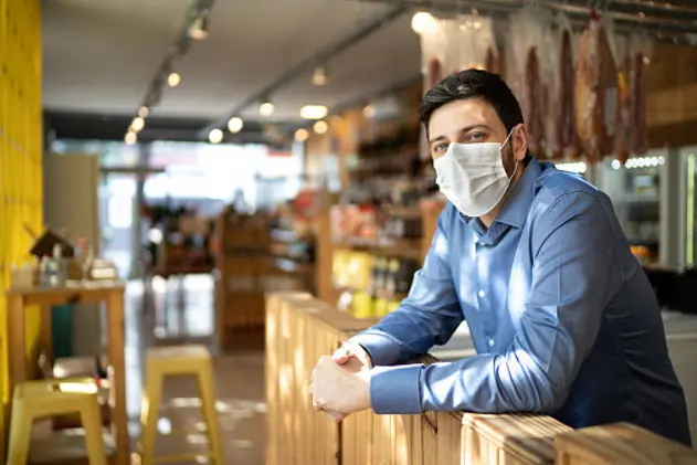 Portrait of small business man owner with face mask