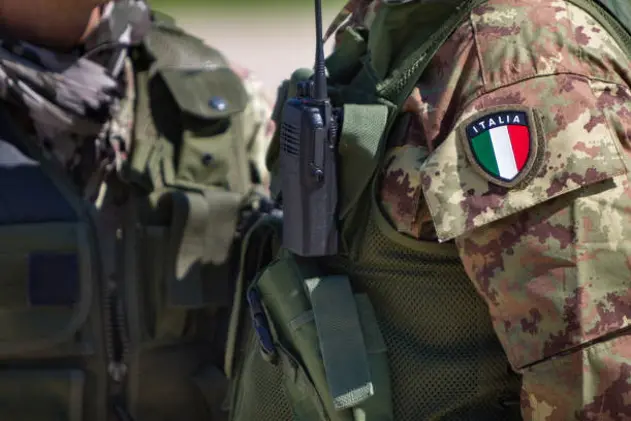 Detail of armed soldier with italian emblem