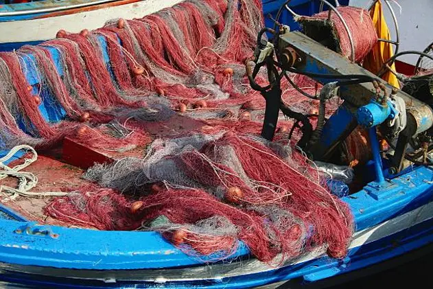 \"Some fishing nets on the deck of a fishing boat.Location: Acitrezza, close to Catania. Sicily, Italy.\"