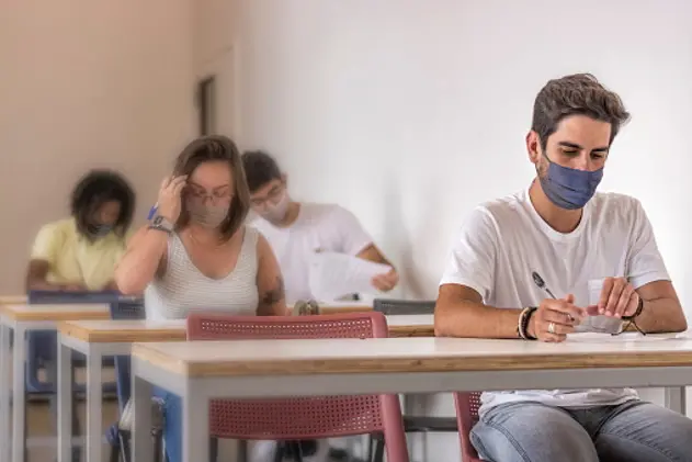 University students in masks taking pre-vestibular test for ENEM maintaining spacing because of COVID-19