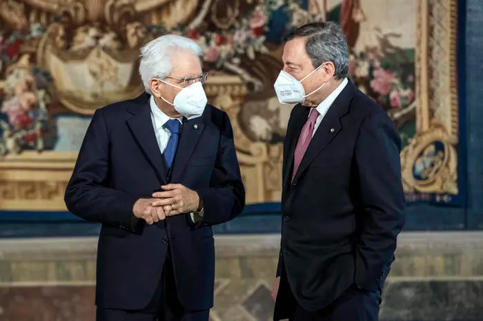 Italian President Sergio Mattarella with Italian Prime Minister Mario Draghi (R) during new government swearing-in ceremony at Quirinal Palace, Rome, 13 February 2021. ROBERTO MONALDO/LAPRESSE/POOL/ANSA