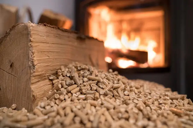 Wood stove heating with in foreground wood pellets - economical heating system concept