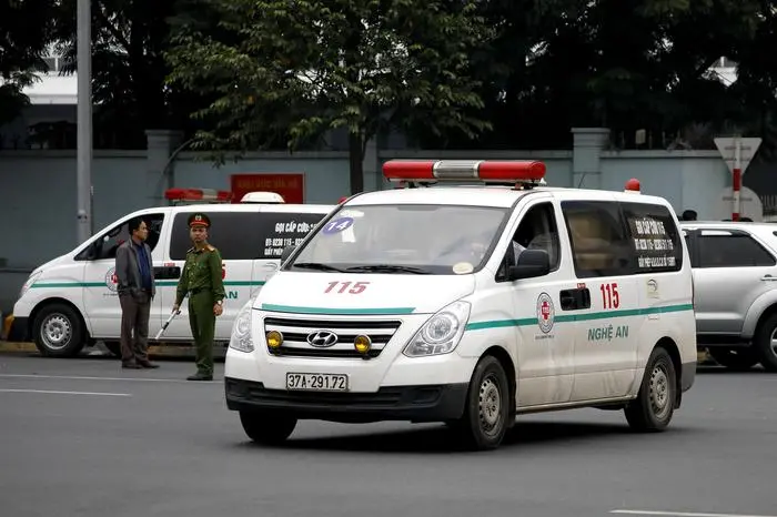 epa08034141 Ambulances carrying bodies of victims found dead in a truck container in Britain, leave Noi Bai airport in Hanoi, Vietnam, 30 November 2019. According to media reports, bodies and ashes of the 23 remaining victims have arrived in Noi Bai airport and have been brought to their hometowns by ambulances. The victims, all migrants from Vietnam, were found dead in a refrigerated lorry in Essex, Britain on 23 October 2019.  EPA/LUONG THAI LINH