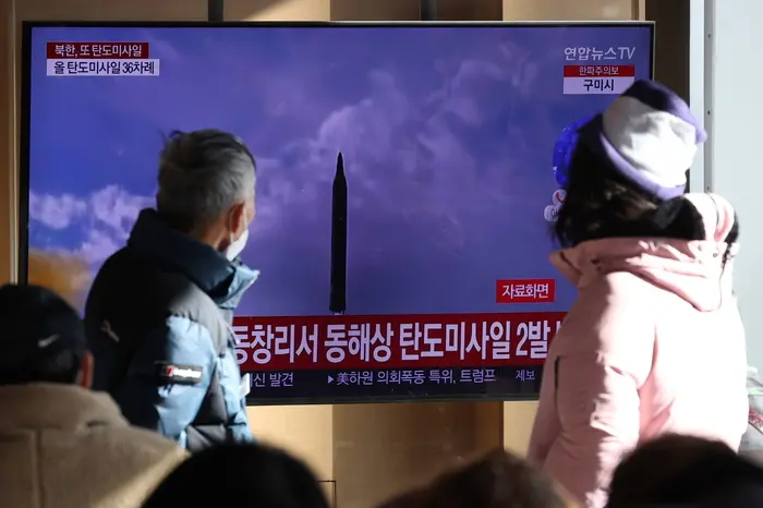 epa10371282 People gathered at Seoul Station watch television news coverage of North Korea\\'s firing of two ballistic missiles toward the East Sea; in Seoul, South Korea, 18 December 2022.  EPA/YONHAP SOUTH KOREA OUT