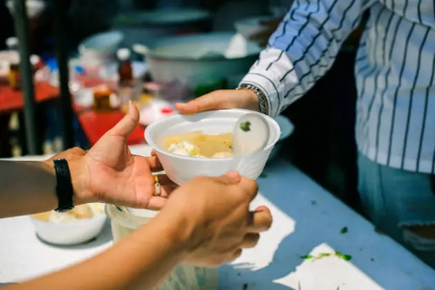 Volunteers give food to the poor : donating food is helping human friends in society : Helping People With Hunger With Kindness : the concept of life problems, hunger in society