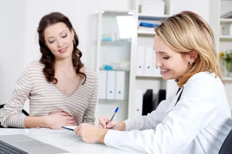 Doctor with young woman