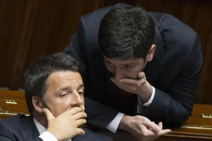 Italian prime minister, Matteo Renzi (L), talks with Roberto Speranza of Democratic Party (R), after delivering a speech to Parliament to explain Italy\\'s priorities for its six-month turn at the rotating presidency of the EU to communicate in the European Council on 26 and 27 June in Ypres and Bruxelles. Rome, 24 June 2014. ANSA/CLAUDIO PERI