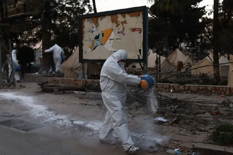 epaselect epa10471225 Turkish soldiers pouring lime on debris and near their habitats against infection and disease after a powerful earthquake in Hatay Turkey, 16 February 2023. More than 41,000 people have died and thousands more are injured after two major earthquakes struck southern Turkey and northern Syria on 06 February. Authorities fear the death toll will keep climbing as rescuers look for survivors across the region.  EPA/SEDAT SUNA