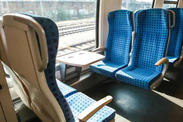 The interior of the train in Germany to move people for long and short distances. Sitting by the window.