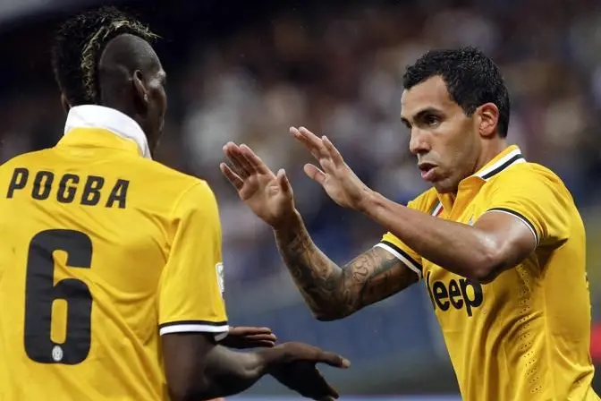 Juventus\\' Carlos Alberto Tevez (R) celebrates with Paul Labile Pogba (L) after scoring against Sampdoria during their Italian Serie A soccer match in Genova, August 24, 2013. \\rREUTERS/Max Rossi (ITALY - Tags: SPORT SOCCER)