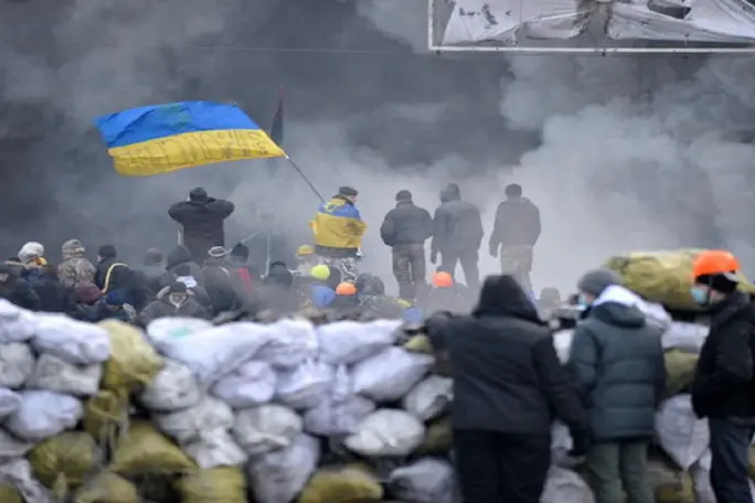 Thousands of anti-government protesters occupy the flashpoint Grushevsky Street in central Kiev on January 25, 2014. The anti-government protests in Ukraine on January 25 spread to the north and east of the country as demonstrators sought to seize regional administration offices that have been occupied in over half a dozen regions in the west. AFP PHOTO / GENYA SAVILOV        (Photo credit should read GENYA SAVILOV/AFP/Getty Images)