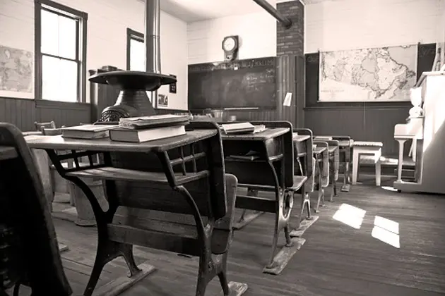 In sepia, a student\\'s view towards the front of a 110 year old one room rural school. Restored