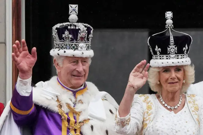 Britain\\'s King Charles III and Queen Camilla wave to the crowds from the balcony of Buckingham Palace after the coronation ceremony in London, Saturday, May 6, 2023. (AP Photo/Frank Augstein)