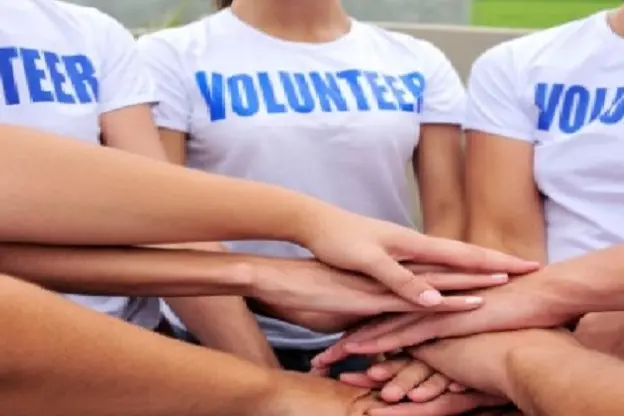 volunteer group hands together