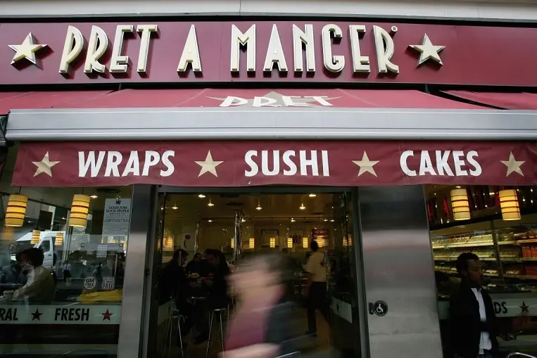 LONDON - APRIL 25:  A man walks past a Pret A Manger coffee ctore in central London on April 25, 2006 in London, England. The all traditional English style Breakfast \\'Fry-Up\\'  is under threat of being replaced by more continental style coffee shops on the High Streets.  (Photo by Daniel Berehulak/Getty Images)