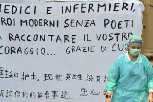 A banner of solidarity and thanksgiving for the doctors and nurses was hung by four Chinese boys at the Santa Maria Nuova hospital during the coronavirus emergency, in Florence, Italy, 12 March 2020. Even tougher lockdown measures kicked in in Italy on Thursday after Premier Giuseppe Conte announced late on Wednesday that all non-essential shops should close as part of the effort to contain the coronavirus.\\nANSA/ CLAUDIO GIOVANNINI