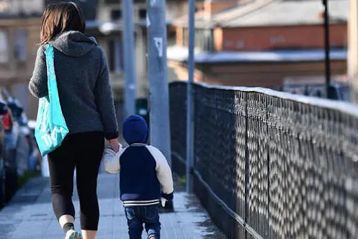 One of the very few mothers with her baby traveling around the city, Genova, Italy, 30 March 2020. Countries around the world are taking measures to stem the widespread of the SARS-CoV-2 coronavirus which causes the Covid-19 disease. ANSA/LUCA ZENNARO