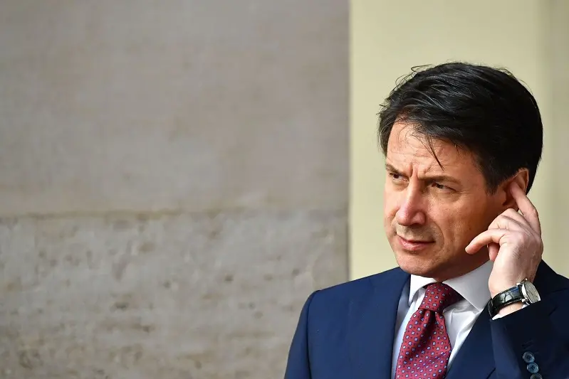 Italian Prime Minister Giuseppe Conte looks on as he waits for the arrival of NATO General Secretary on June 11, 2018 at Chigi palace in Rome. (Photo by Alberto PIZZOLI / AFP)        (Photo credit should read ALBERTO PIZZOLI/AFP/Getty Images)