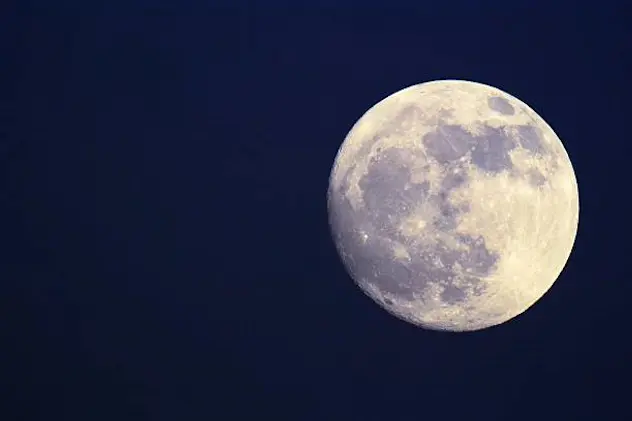 Full moon with visible surface.