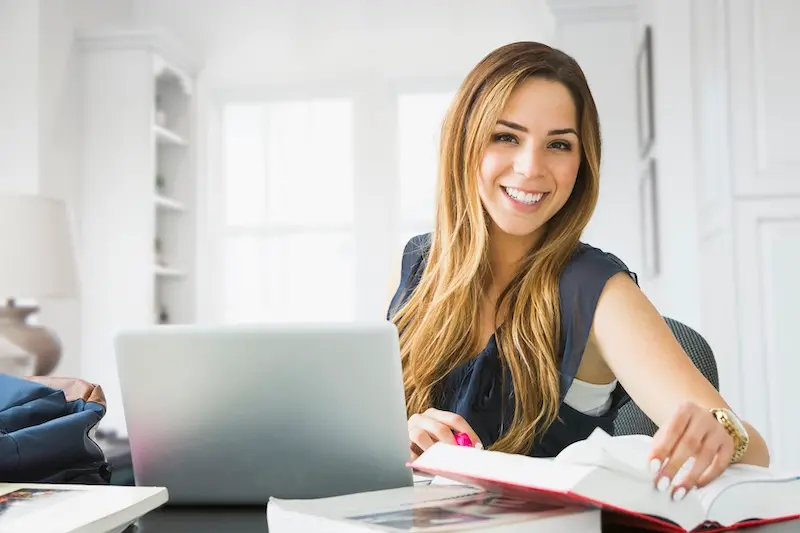 Mixed race woman studying at home