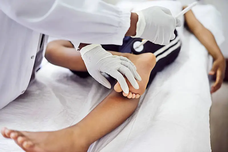 Shot of a pediatrician doing a checkup on a young boy