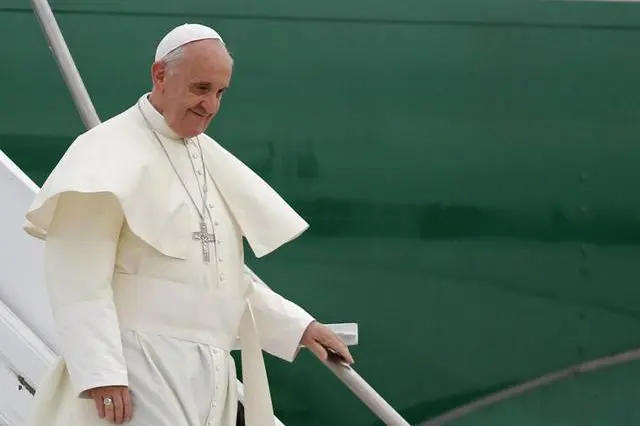 Pope Francis deplanes upon his arrival at the international airport in Rio de Janeiro, Brazil, Monday, July 22, 2013. In his first international trip as pope, Francis has built much of his schedule in the world\\'s biggest Catholic country around high-profile events that send him straight into unpredictable environments - without the protection of the bulletproof popemobile used by his two predecessors.  (AP Photo/Jorge Saenz)