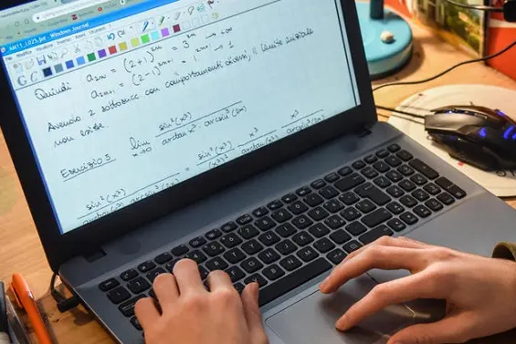 A student follows an online lesson in front of the personal computer due to the closure of the schools for  the emergency from COVID-19, Milan, April 2, 2020. ANSA / MATTEO CORNER