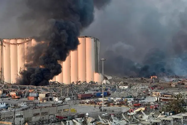 epa08583746 A general view of the harbor area with smoke billowing from an area of a large explosion, with damage and debris after a large explosion rocked the harbor area of Beirut, Lebanon, 04 August 2020. According to reports, several people have been injured and large area badly damaged.  EPA/WAEL HAMZEH