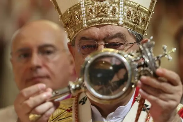 Cardinal Crescenzio Sepe, the Archbishop of Naples, hold up a phial said to contain the blood of the 3rd-century saint San Gennaro while a traditional white handkerchief was waved, Naples, 19 September 2017. The \\'Miracle\\' of San Gennaro was allegedly repeated on 19 September when the blood of Naples\\' patron saint liquefied at 10:38 Italian time. A huge crowd of faithful, who had been pouring into the city\\'s cathedral and the square outside from the early hours of the day, greeted the announcement of the miracle recurrence with warm applause. \\nANSA / CESARE ABBATE