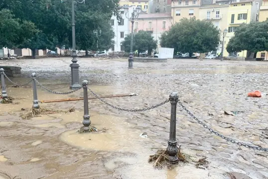 epa08850595 A view on a flodded square in Bitti in the Sardinia island, Italy, 29 November 2020. According to reports, three people have been killed in a flooding and mudslides after heavy rains in Bitti.  EPA/CRISTIAN FARINA